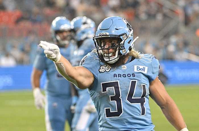 Jun 18, 2023; Toronto, Ontario, CAN; Toronto Argonauts running back AJ Ouellette (34) gestures after running for a first down against the Hamilton Tiger-Cats in the fourth quarter at BMO Field. Mandatory Credit: Dan Hamilton-USA TODAY Sports